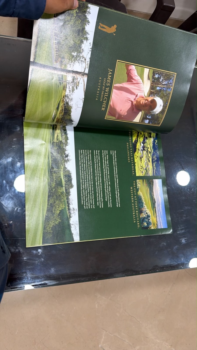 Open spread of a premium golf township brochure.