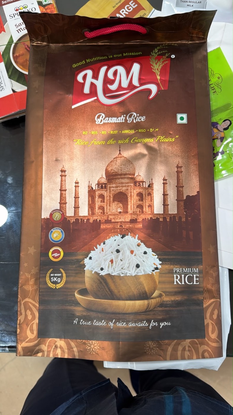 Laminated basmati rice bag with rope handle.